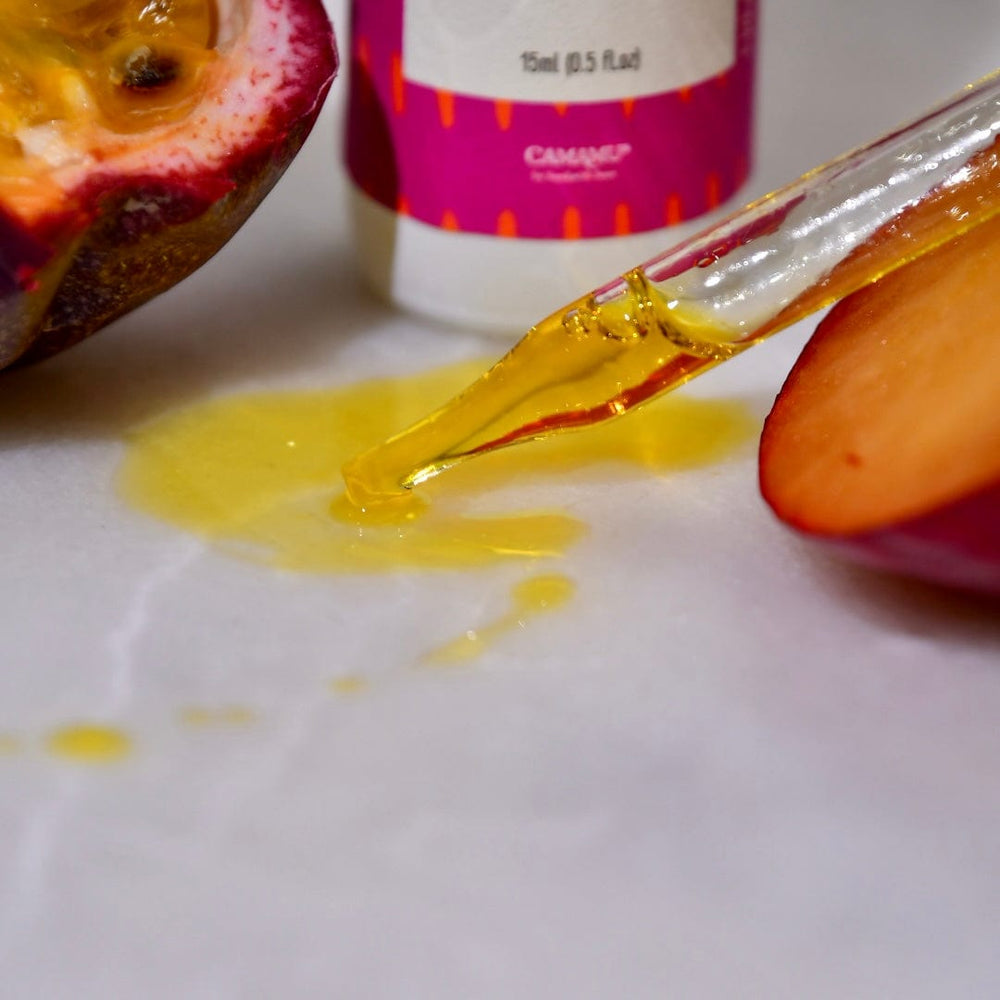 Plum oil dropper shot with passionfruit and plum.