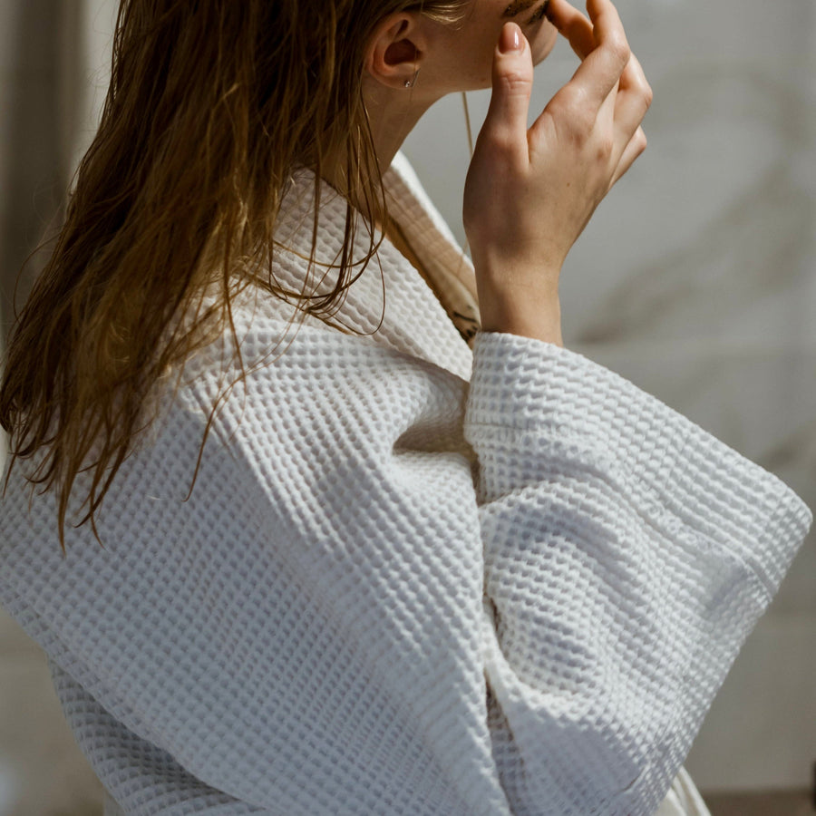 Woman in robe by Polina Kovaleva