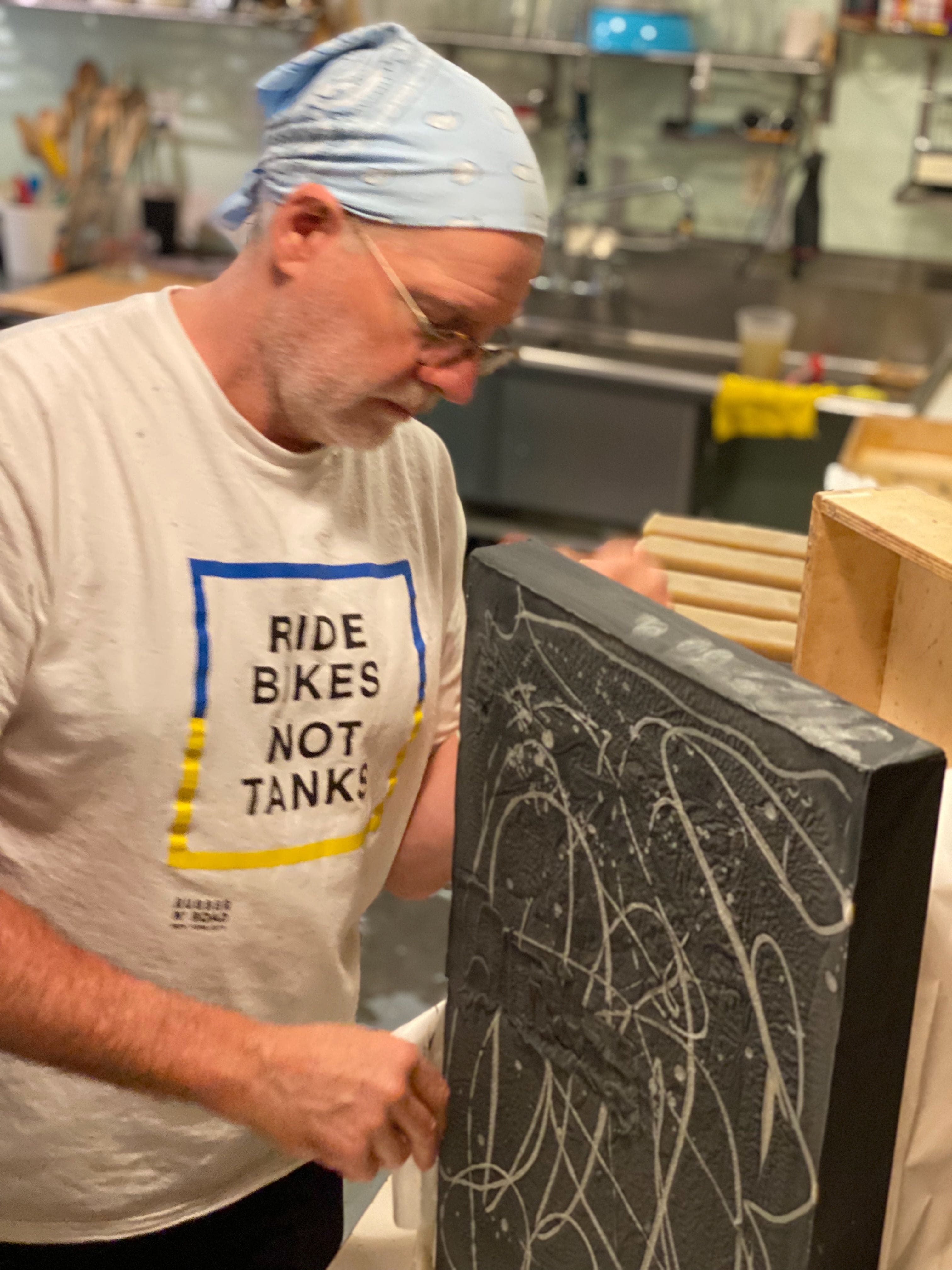 Artist stu_bLB with Ride Bikes Not Tanks art piece