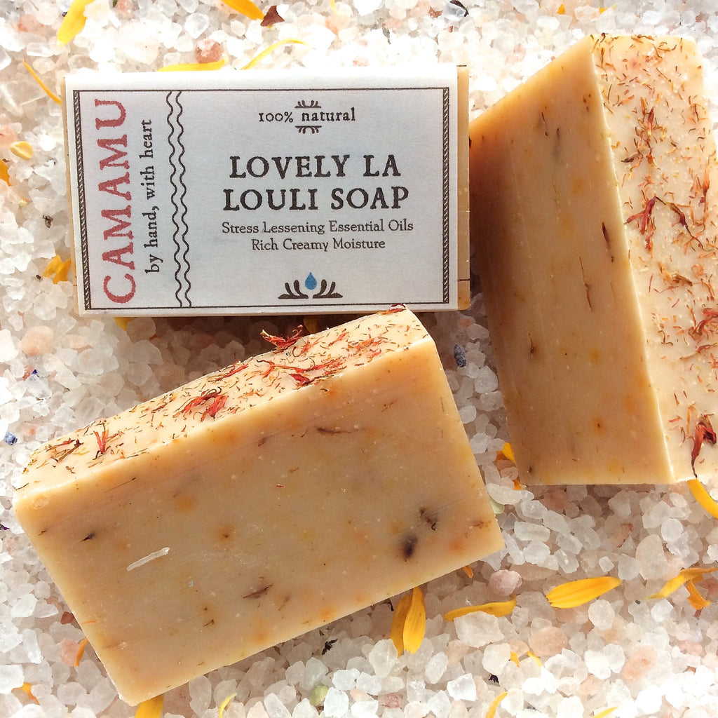 Camamu's Lovely la LouLi Soap combines a stress-reducing essential oil blend with richly moisturizing base oils to create a beauty of a soap.  Colored orange with culinary spices and safflower petals. Lovely!